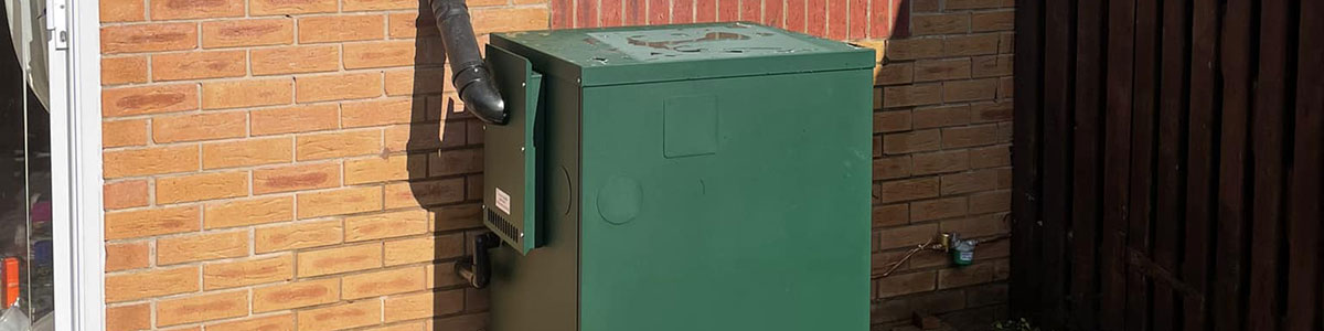 External oil boiler outside house in Oswestry