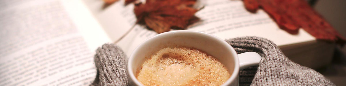 Cup of coffee with Autumn leaves
